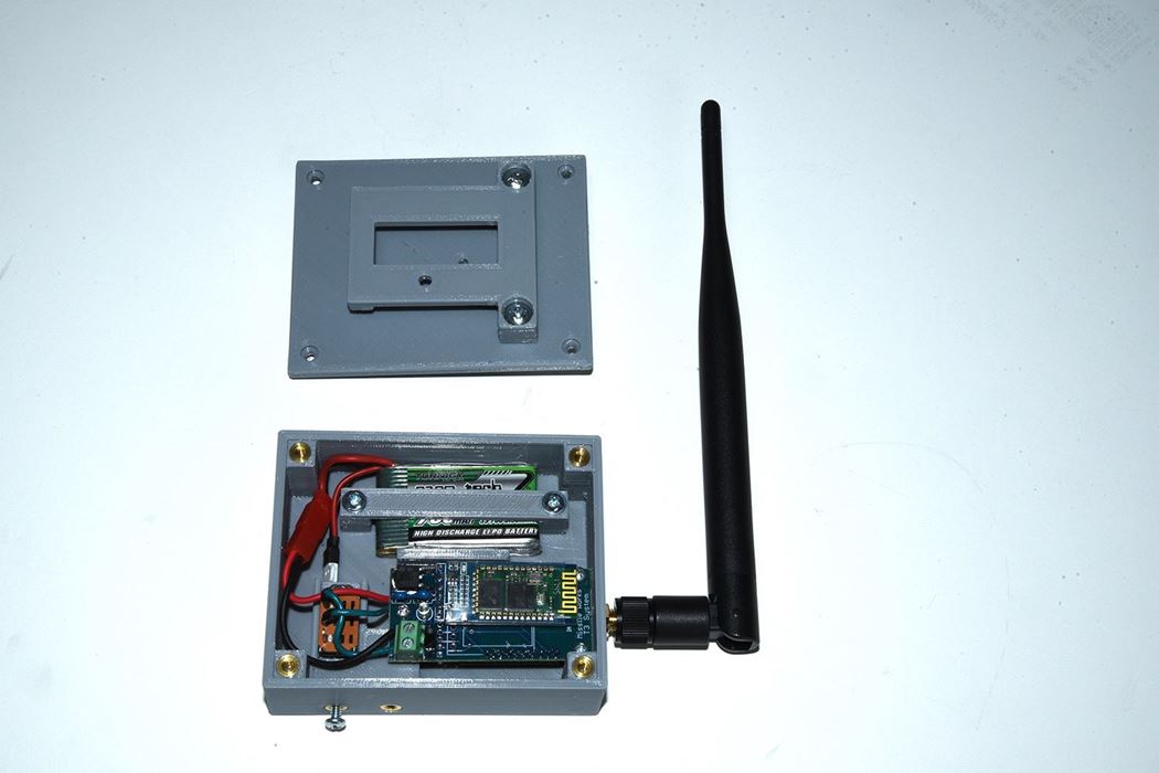 Assembled T3 receiver case with the belt clip lid removed to show case internals (customer supplies T3 receiver, antenna and battery)